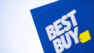 Best Buy logo on a building against a blue sky