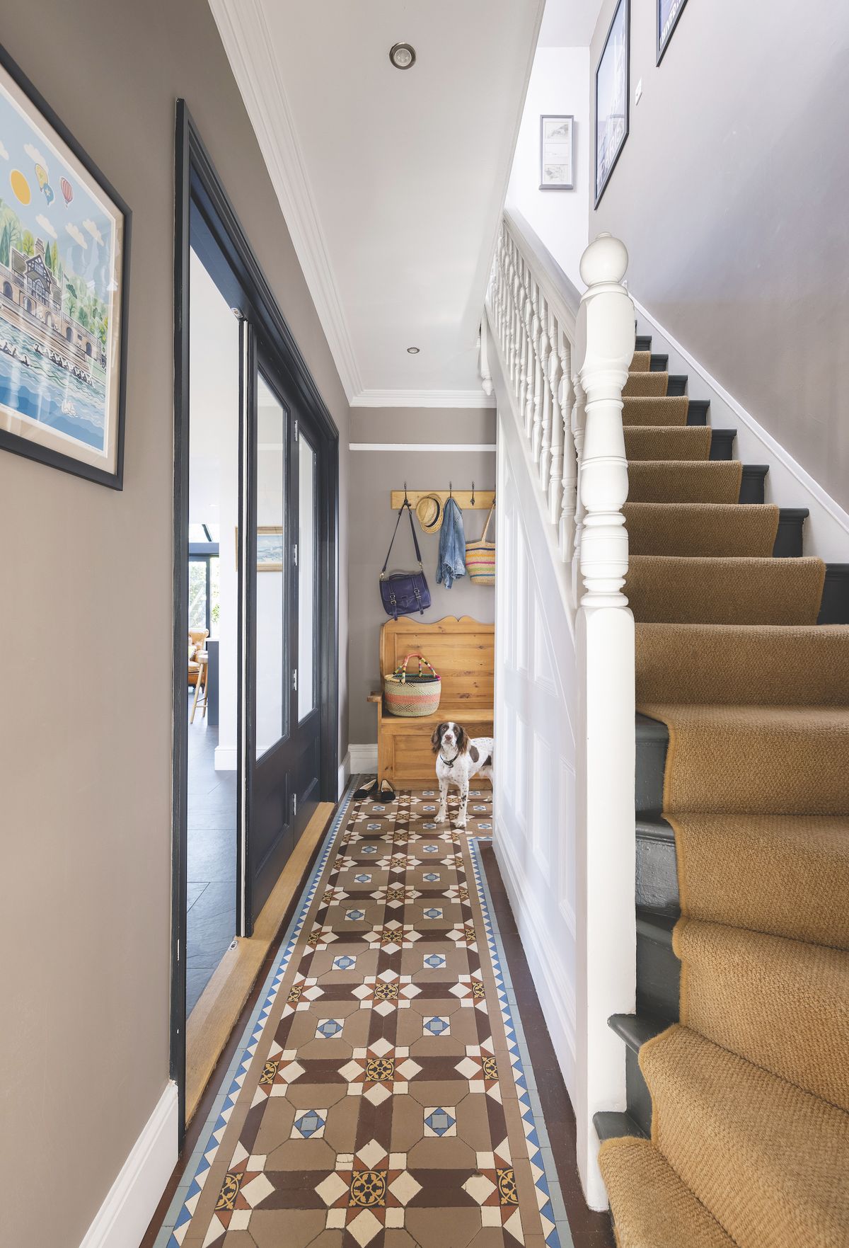 glass internal doors in traditional victorian hallway with staircase