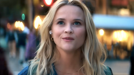 Reese Witherspoon, smiling and looking up in "Your Place or Mine."