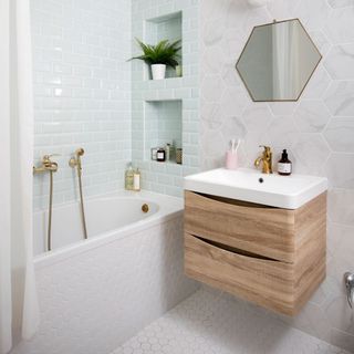 Bathroom with hexagonal tiles and blue wall tiles