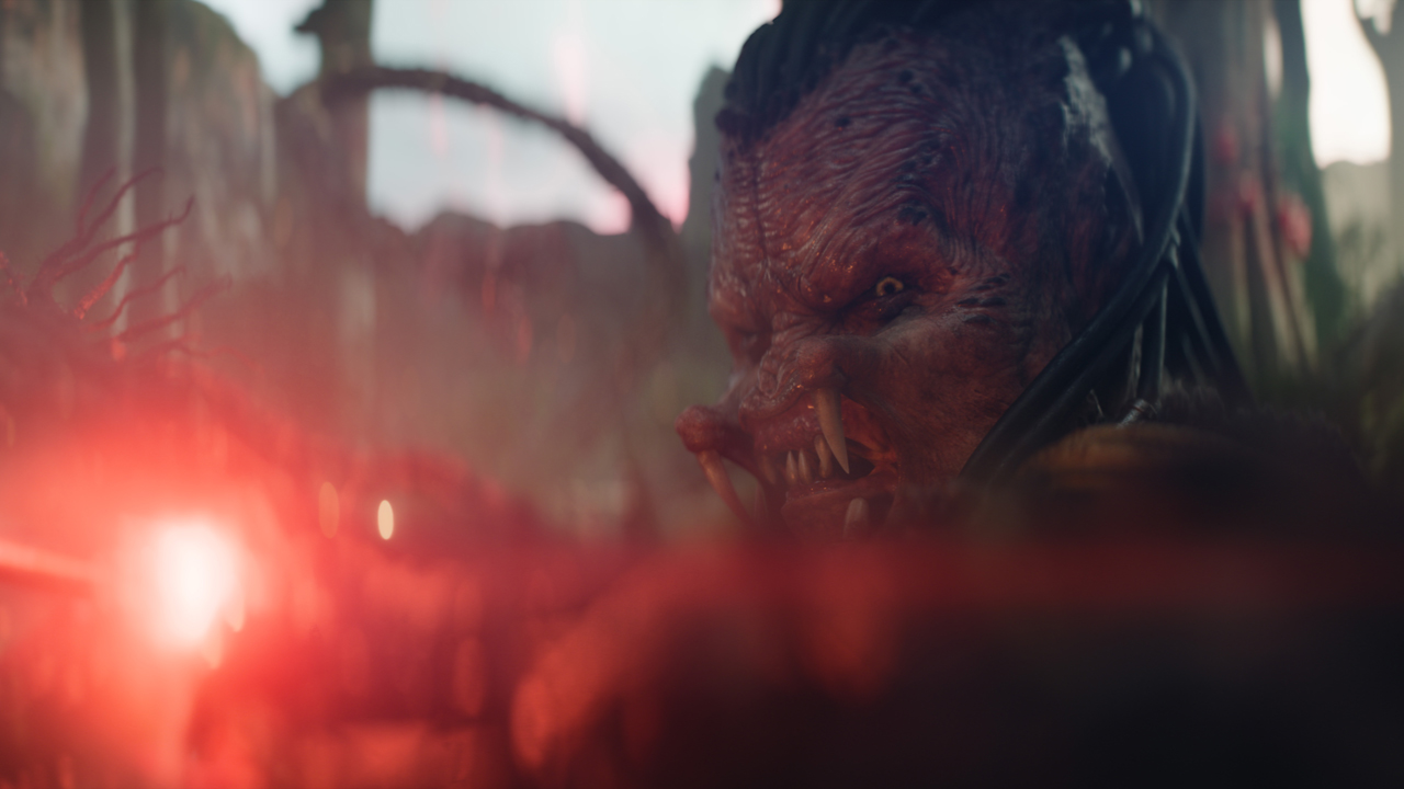 Dek aiming a gun in Predator: Badlands