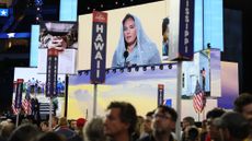 Harmeet Dhillon on a megascreen at the 2024 Republican National Convention, offering a Sikh prayer