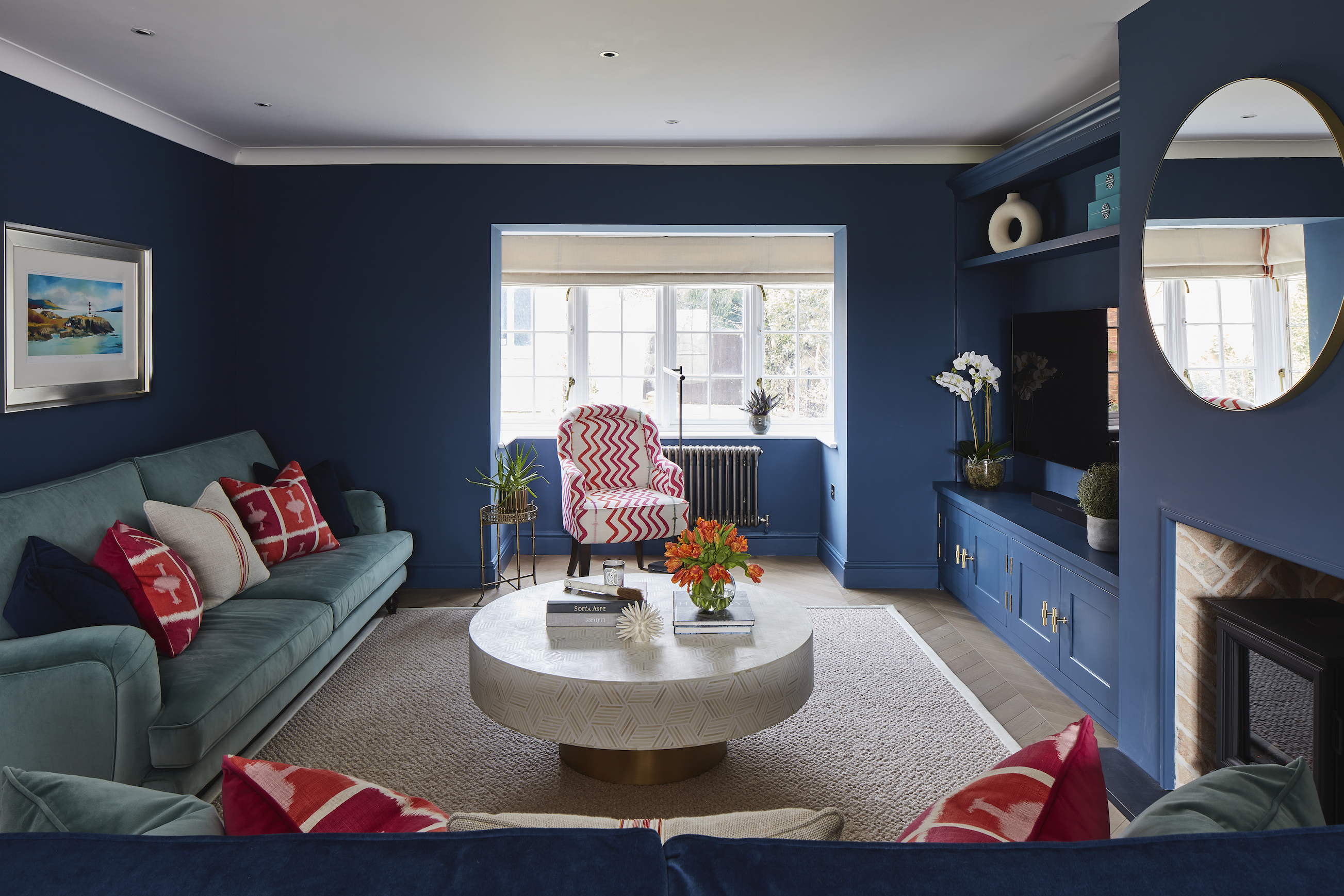 dark blue living room with wood floor and open shelving