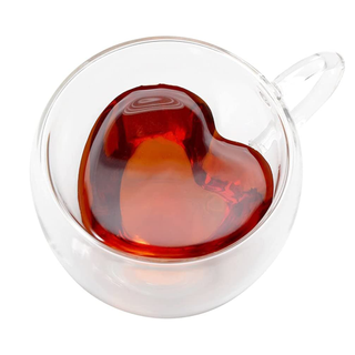 A glass mug with a heart-shaped center