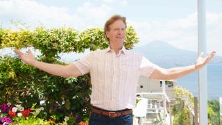 Nick (Jack Wagner) with his arms open in Italy in The Bold and the Beautiful