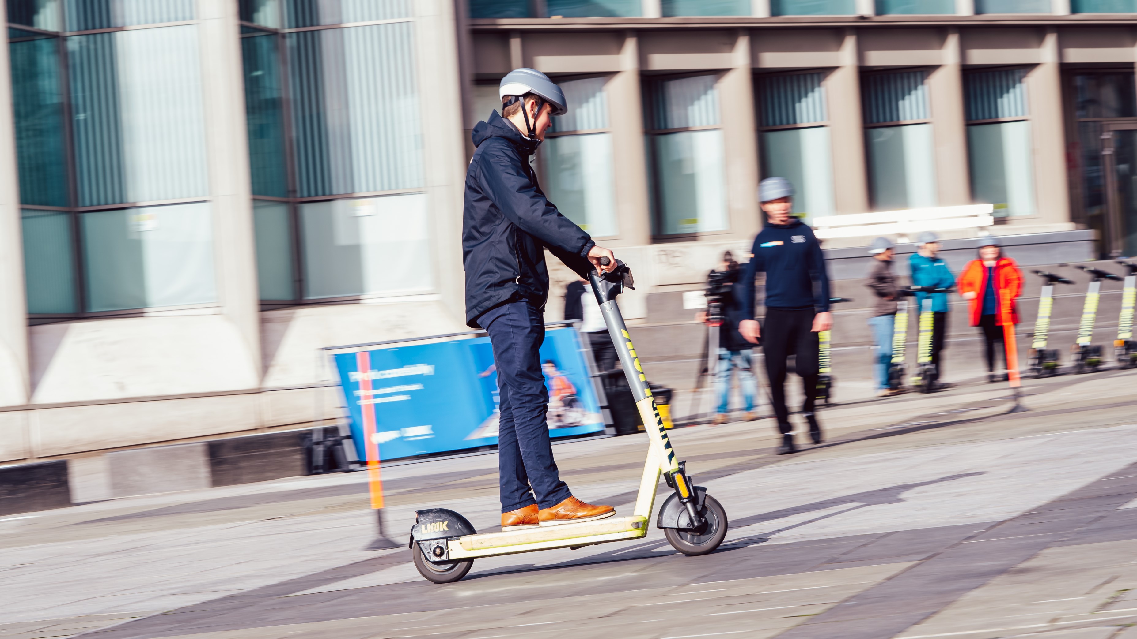 Man riding Superpedestrian LINK e-scooter