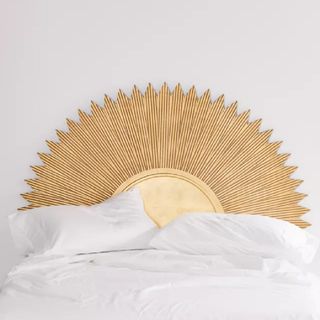 A wooden sun style headboard