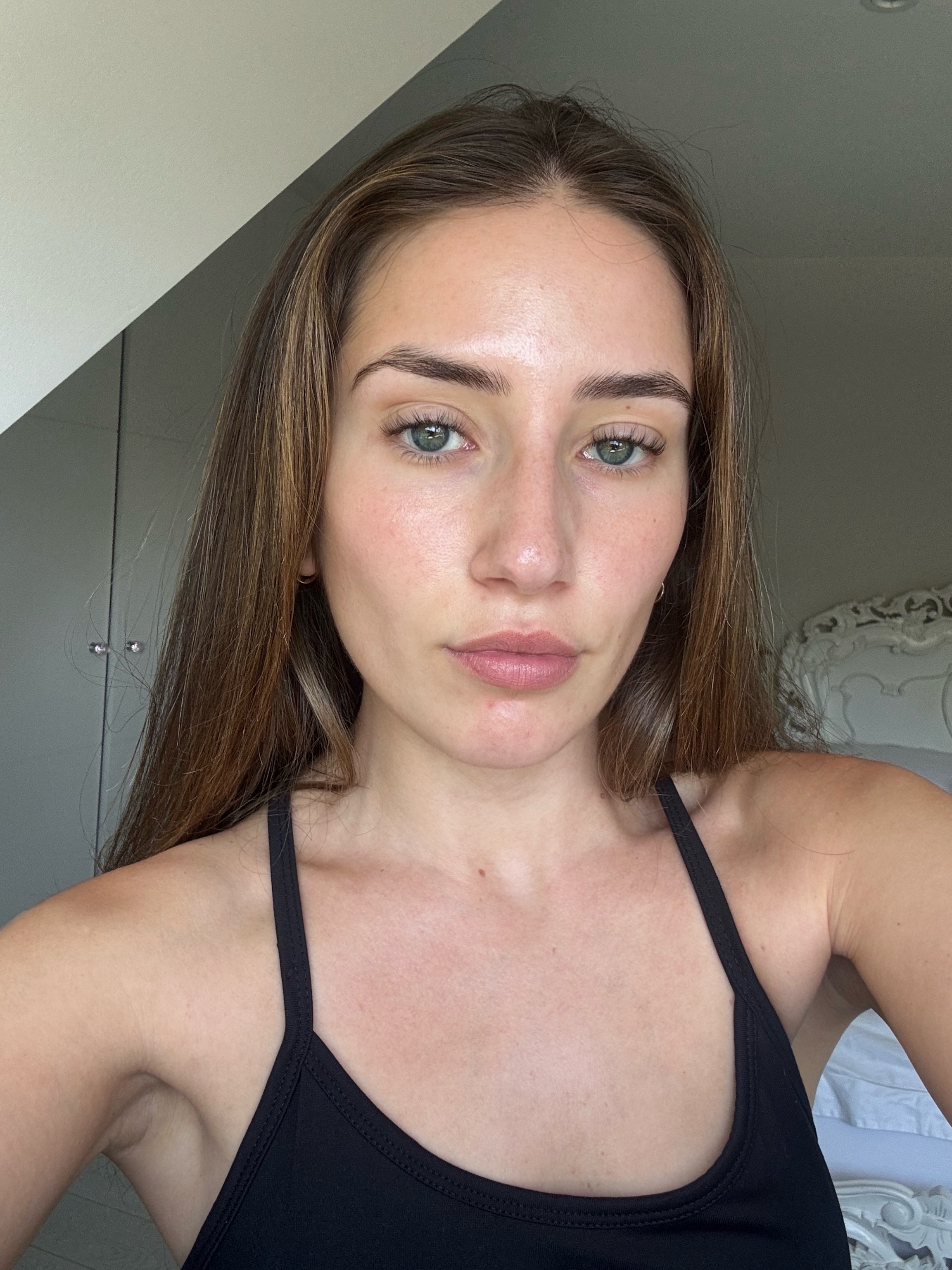 Darcy Brown before using Merit The Uniform Tinted Mineral SPF 50