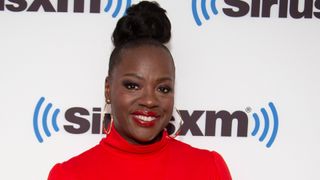 Viola Davis wearing soft purple makeup with red lipstick