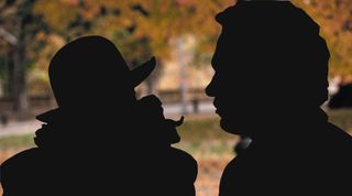 Silhouetted actors in a movie scene