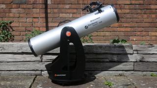 Celestron dobsonian telescope in garden