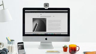 A product image of the best MacBook webcam on a mac sat on a desk