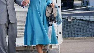 Queen Camilla leaves after attending a reception on the flight deck of HMS Iron Duke