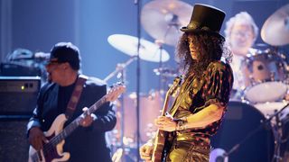 Slash onstage with Billy Cox and Mitch Mitchell