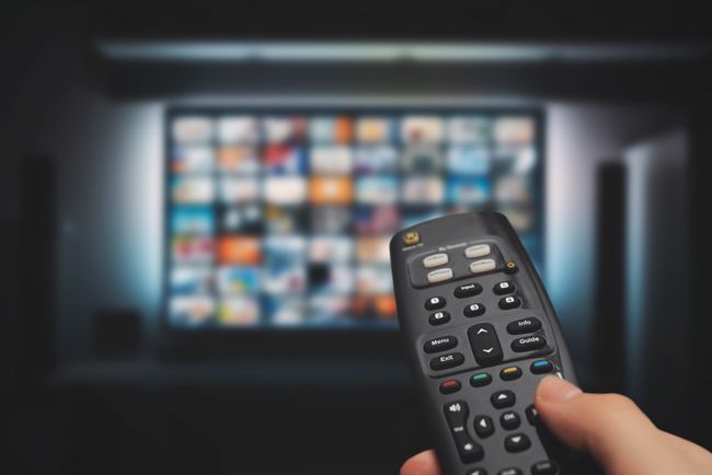 A remote control pointing at a TV