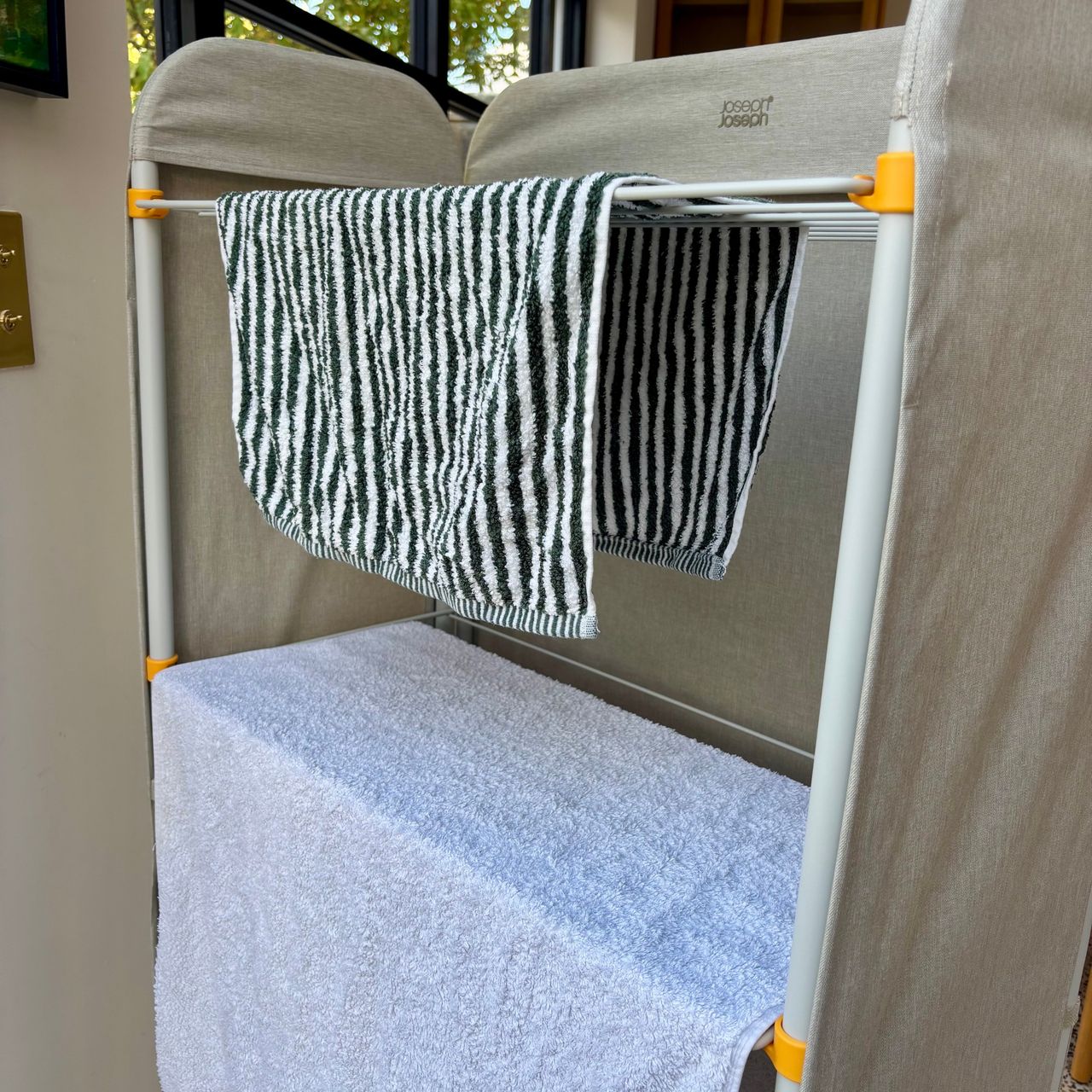 drying towels on the joseph joseph eclipse clothes airer