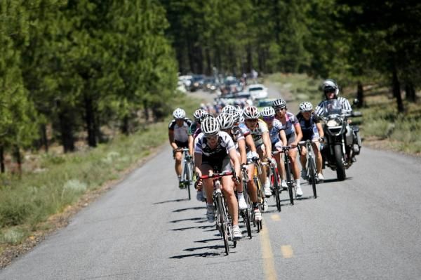 The women's field chases on the climb.