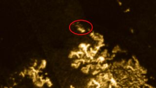 The strange anomaly in Titan's seas is circled in red.