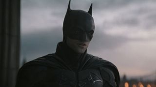 Batman (Robert Pattinson) talks to Selina Kyle in The Batman.