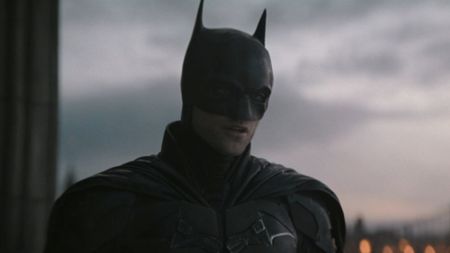Batman (Robert Pattinson) talks to Selina Kyle in The Batman.