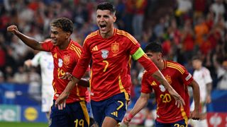 Spain's Lamine Yamal and Alvaro Morata celebrate Riccardo Calafiori's own goal during their match against Italy.