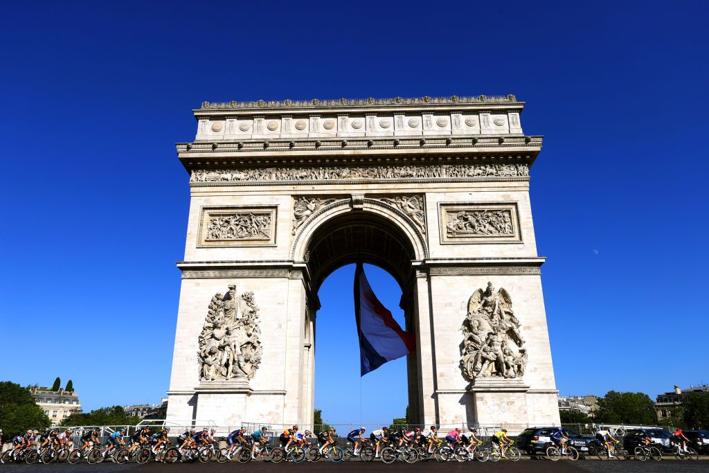 PARIS FRANCE JULY 18 Tadej Pogaar of Slovenia and UAETeam Emirates Yellow Leader Jersey The Peloton in front of The Arc De Triomphe at Paris city during the 108th Tour de France 2021 Stage 21 a 1084km stage from Chatou to Paris Champslyses LeTour TDF2021 on July 18 2021 in Paris France Photo by Tim de WaeleGetty Images