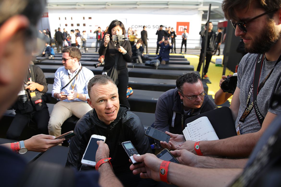 Chris Froome talks to the press