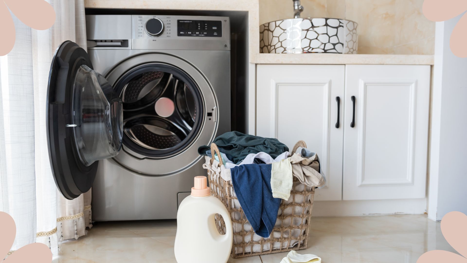 picture of open washing machine with basket of clothes outside it 