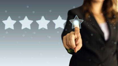 A woman pointing to five stars