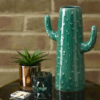 cactus vase with plant pot and glass candle