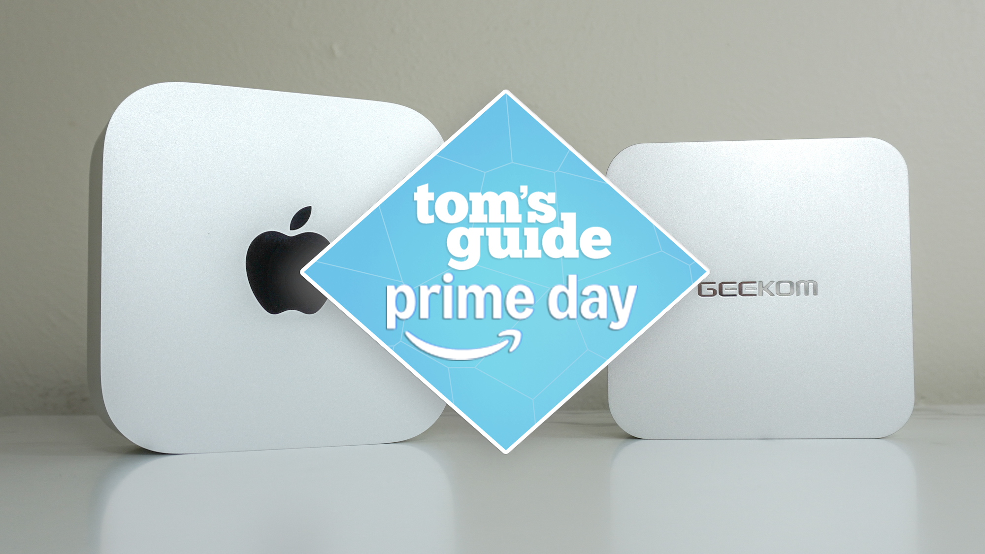 A Mac mini M4 next to the Geekom A6 with a Tom&#039;s Guide Prime Day deals badge