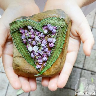 garden games with purple petal necklace and pebbles