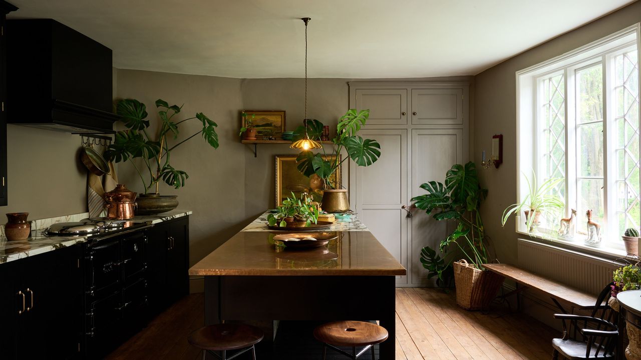 deVOL kitchen with black cabinets and island.