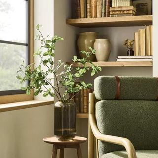 A piece of artificial greenery from Hearth & Hand with magnolia in a vase