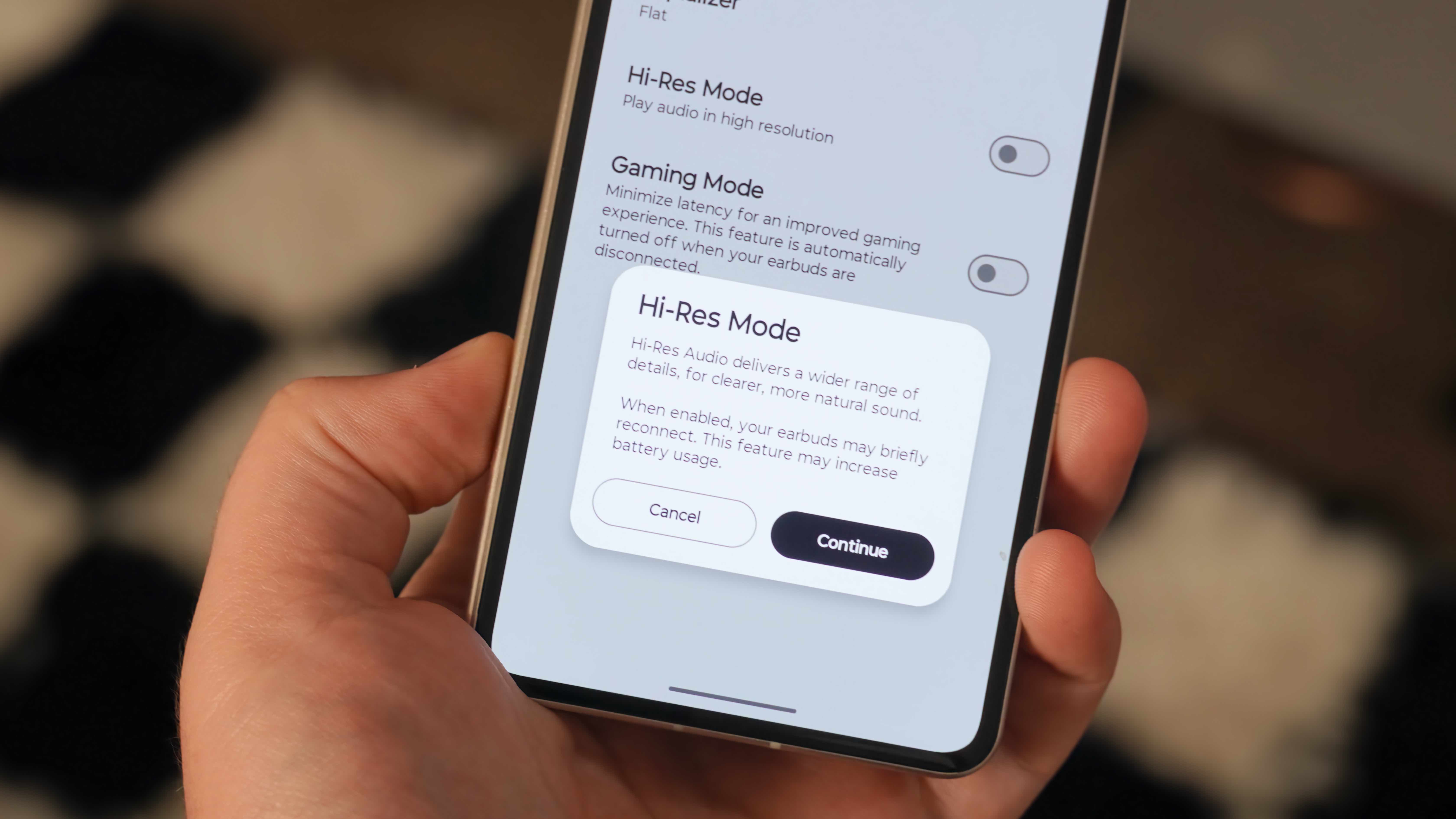 The Moto Buds 2 Plus alongside their companion app showing settings to change to improve audio quality.