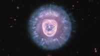 A purple bright center is surrounded by darker purple and blue bright light. 