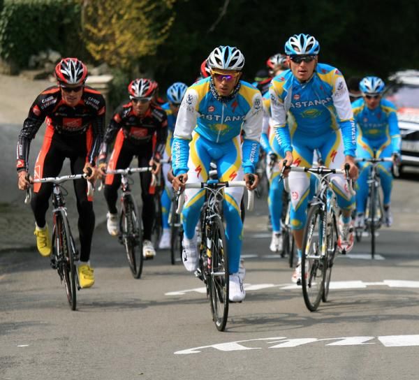 Astana riders train next to the Caisse d'Epargne crew.