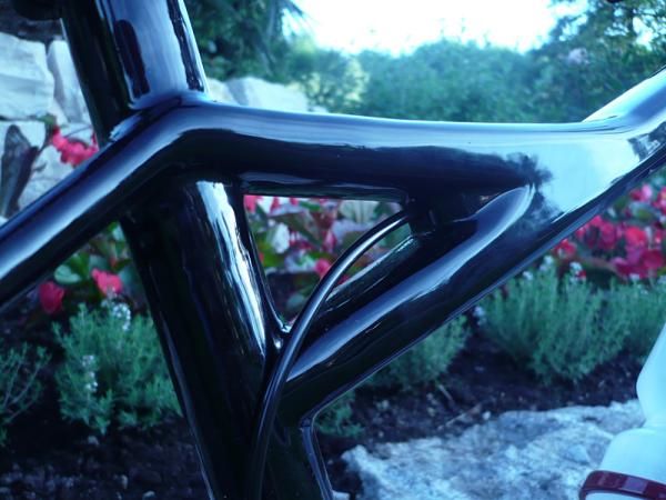 This gusset enabled designer to get more standover height by lowering the main part of the top tube.