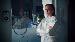Jac Naylor in protective clothing awaits the test results.