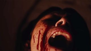 Tatiana Maslany as Liz screaming with blood running down her face in the trailer for Keeper