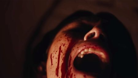 Tatiana Maslany as Liz screaming with blood running down her face in the trailer for Keeper
