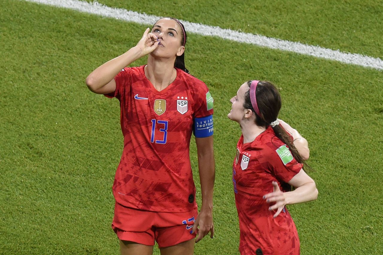 Alex Morgan enjoys a cup of tea after scoring a goal against England.