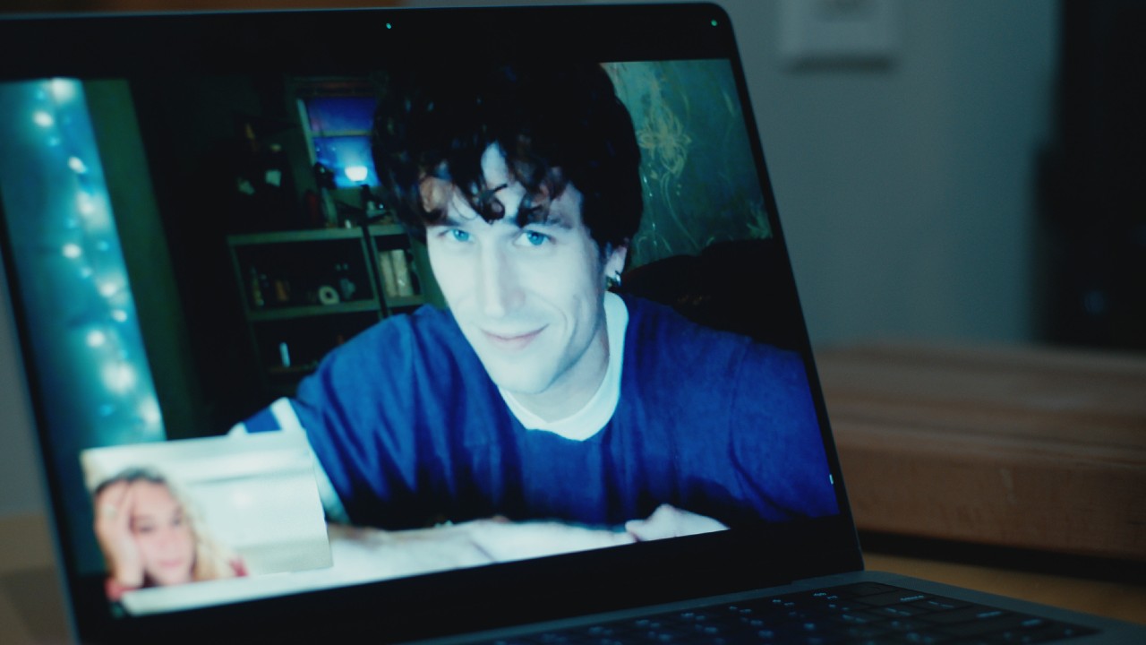 Brandon Flynn on a computer screen with Tatiana Maslany in the bottom left-hand corner of the Zoom call.