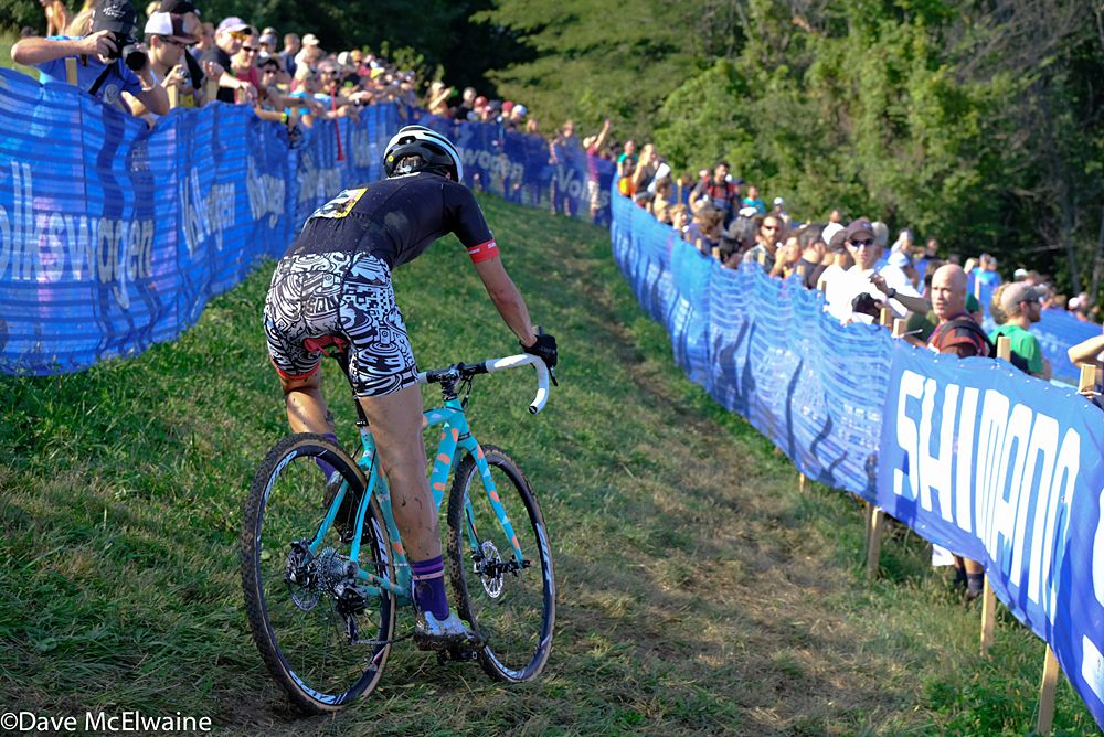 Emily Kachorek (USA) riding the off-camber switchbacks off the top of the hill