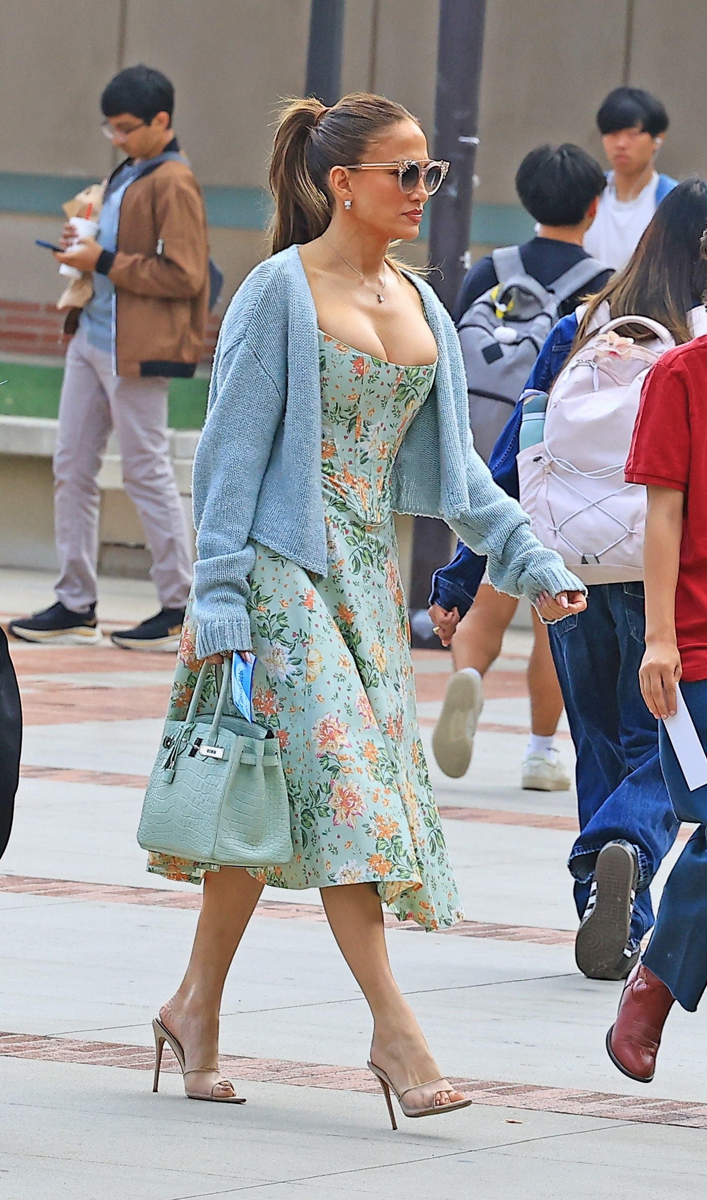 Jennifer Lopez attended her son's high school graduation in a mint green summer dress and a matching croc Herm&amp;egrave;s Birkin bag