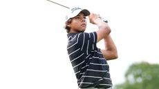 Charlie Woods hits an iron shot at the US Junior Amateur