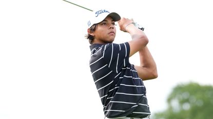 Charlie Woods hits an iron shot at the US Junior Amateur