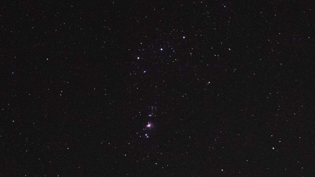 The Orion Nebula and Orion's Belt in the night sky