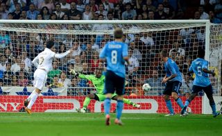 Cristiano Ronaldo scores for Real Madrid against Ajax in the Champions League in 2011.
