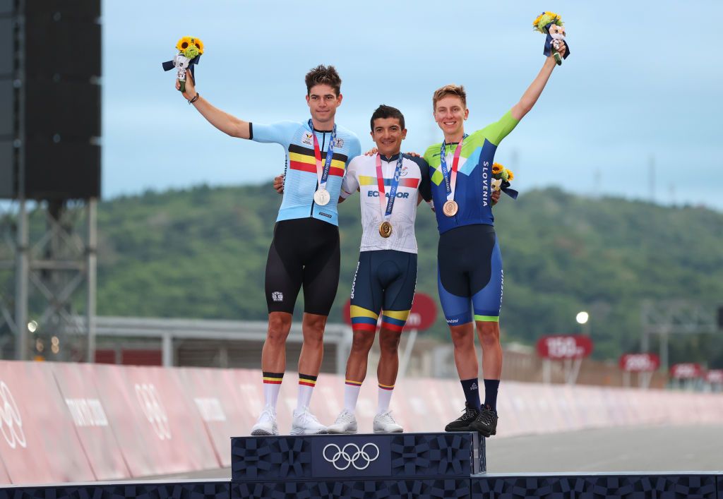 OYAMA JAPAN JULY 24 LR Silver medalist Wout van Aert of Team Belgium gold medalist Richard Carapaz of Team Ecuador and bronze medalist Tadej Pogacar of Team Slovenia pose on the podium during the medal ceremony during the Mens road race at the Fuji International Speedway on day one of the Tokyo 2020 Olympic Games on July 24 2021 in Oyama Shizuoka Japan Photo by Michael SteeleGetty Images